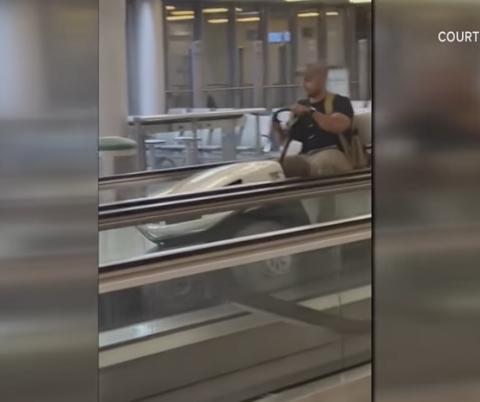 Wyoming man driving golf cart in airport terminal
